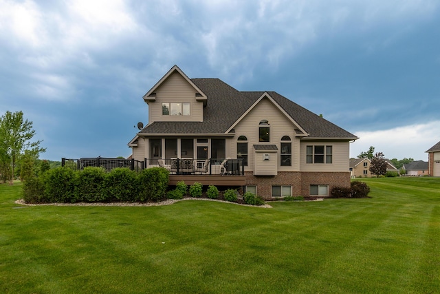 133 E Auburn Trl, Brighton, MI 48114 - rear view of house with a lawn, a sunroom, roof with shingles, and a deck