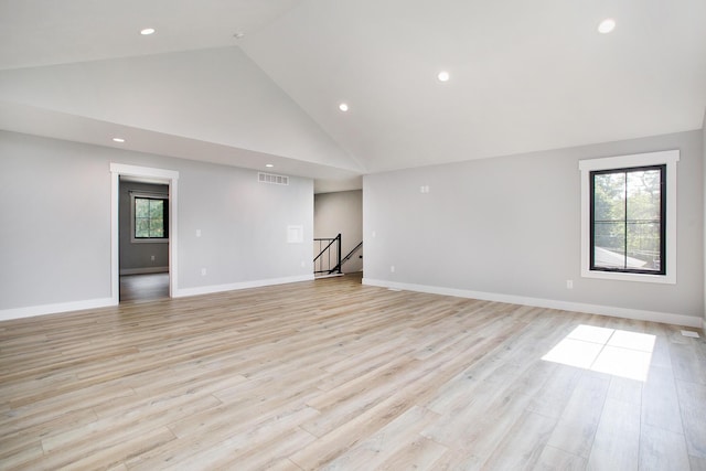 6646 E Eagle Lake Dr, Kalamazoo, MI 49009 - empty room with light wood-style flooring, high vaulted ceiling, recessed lighting, and baseboards