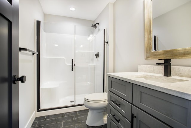 6646 E Eagle Lake Dr, Kalamazoo, MI 49009 - bathroom featuring a shower stall, vanity, toilet, baseboards, and recessed lighting