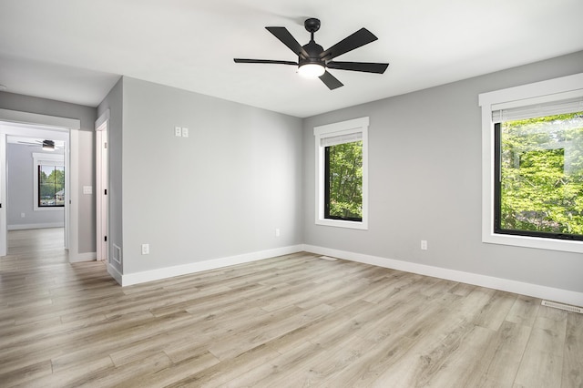 6646 E Eagle Lake Dr, Kalamazoo, MI 49009 - unfurnished room featuring plenty of natural light, ceiling fan, and baseboards