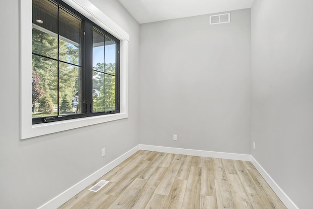 6646 E Eagle Lake Dr, Kalamazoo, MI 49009 - spare room with baseboards and light wood-type flooring