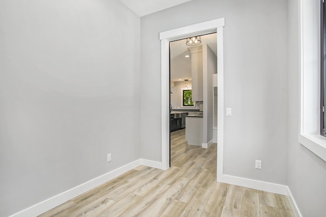 6646 E Eagle Lake Dr, Kalamazoo, MI 49009 - unfurnished room with baseboards and light wood-style flooring