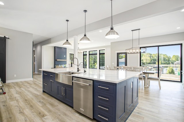 6646 E Eagle Lake Dr, Kalamazoo, MI 49009 - kitchen featuring stainless steel dishwasher, a sink, light wood-style floors, recessed lighting, and baseboards