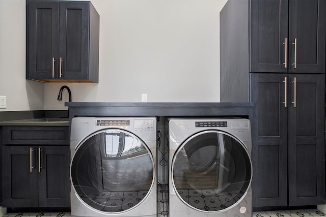 6646 E Eagle Lake Dr, Kalamazoo, MI 49009 - laundry room featuring cabinet space and washing machine and dryer