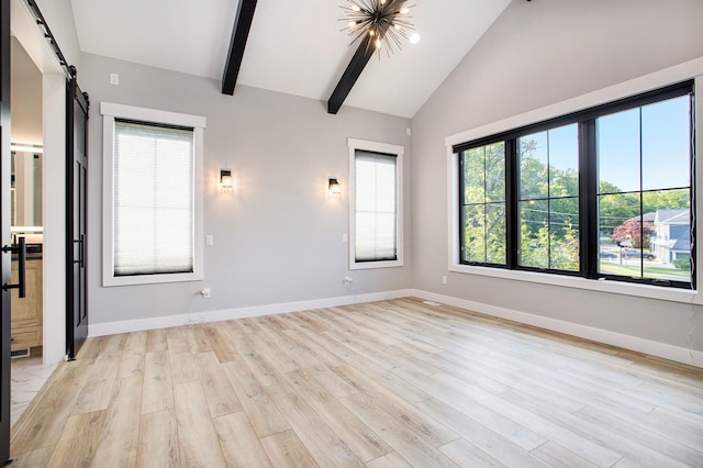 6646 E Eagle Lake Dr, Kalamazoo, MI 49009 - spare room with a barn door, baseboards, light wood finished floors, beamed ceiling, and a chandelier