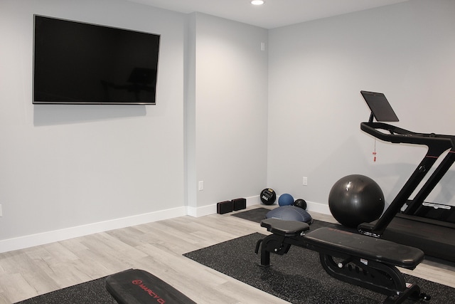6646 E Eagle Lake Dr, Kalamazoo, MI 49009 - workout area with wood finished floors, recessed lighting, and baseboards