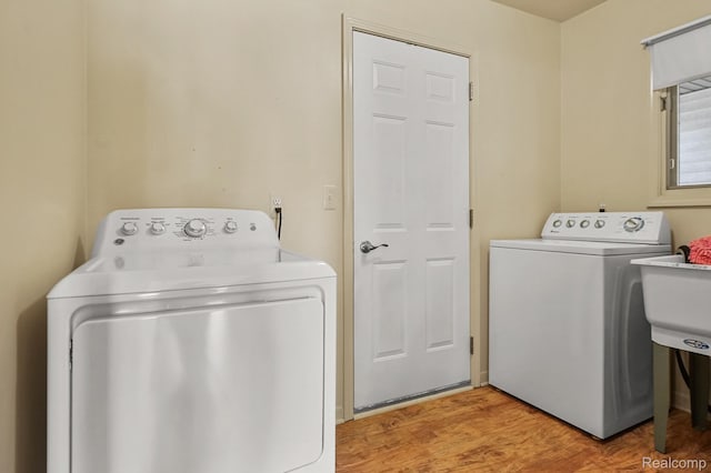 13716 Maple Grove Ave, Shelby Twp, MI 48315 - washroom with independent washer and dryer and light wood finished floors