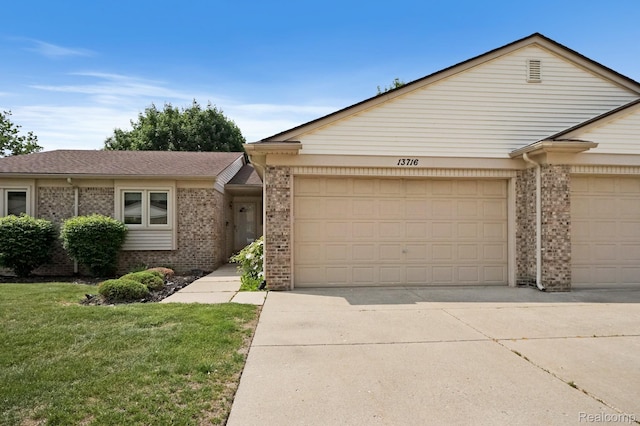 13716 Maple Grove Ave, Shelby Twp, MI 48315 - view of front of property featuring brick siding, an attached garage, driveway, and a front lawn