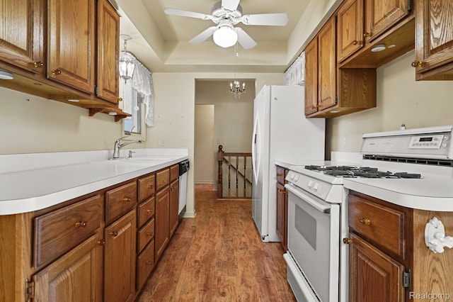 13716 Maple Grove Ave, Shelby Twp, MI 48315 - kitchen featuring white appliances, a sink, and brown cabinetry