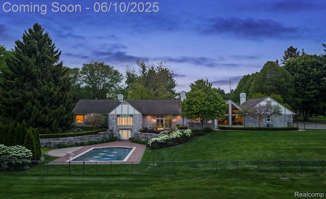 530 E Long Lake Rd, Bloomfield Hills, MI 48304 - back of property with stone siding, a chimney, and a jacuzzi