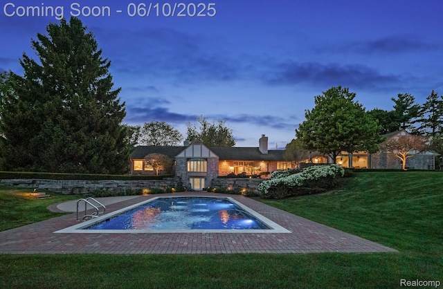 530 E Long Lake Rd, Bloomfield Hills, MI 48304 - pool at dusk featuring a lawn