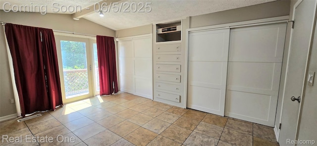 3825 Thomas Rd, Oxford, MI 48371 - unfurnished bedroom with access to exterior and a textured ceiling