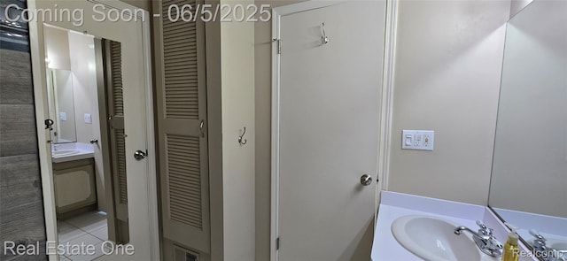 3825 Thomas Rd, Oxford, MI 48371 - bathroom featuring a closet, vanity, and tile patterned floors