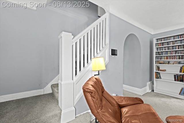 14435 Prevost St, Redford, MI 48227 - sitting room with carpet flooring, built in shelves, stairway, and arched walkways