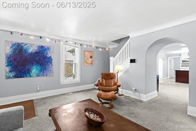 14435 Prevost St, Redford, MI 48227 - carpeted living area with arched walkways and stairs