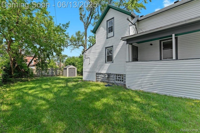 14435 Prevost St, Redford, MI 48227 - view of grassy yard featuring a shed