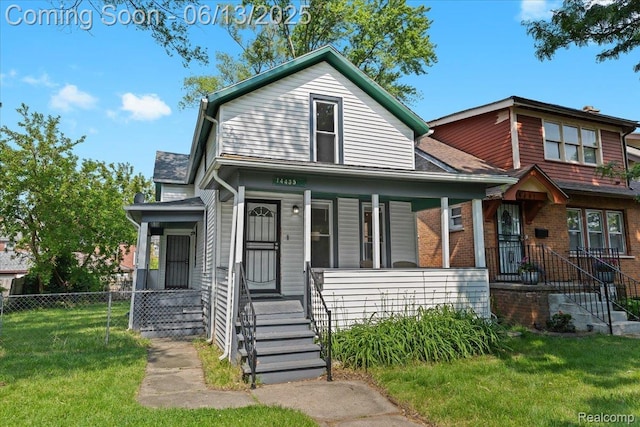 14435 Prevost St, Redford, MI 48227 - view of front of house featuring brick siding, a porch, and roof with shingles