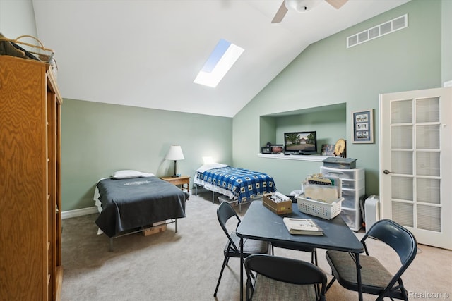10172 Clarkshire Ct, South Lyon, MI 48178 - carpeted bedroom featuring a skylight, vaulted ceiling, ceiling fan, and baseboards