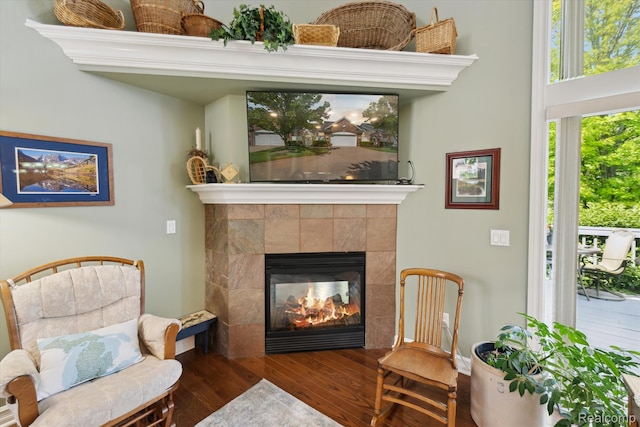 10172 Clarkshire Ct, South Lyon, MI 48178 - living area featuring wood finished floors and a fireplace