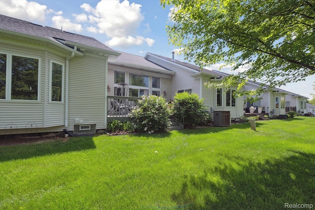 10172 Clarkshire Ct, South Lyon, MI 48178 - view of grassy yard featuring central air condition unit and a deck