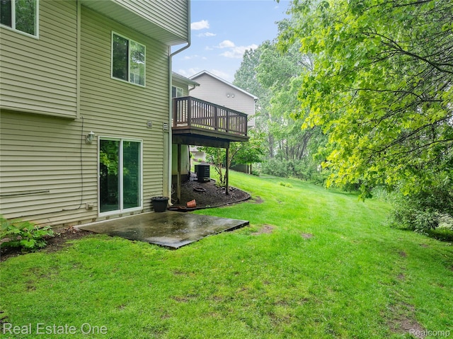 8859 Redstone Dr, Pinckney, MI 48169 - view of green lawn with a patio, a deck, and cooling unit