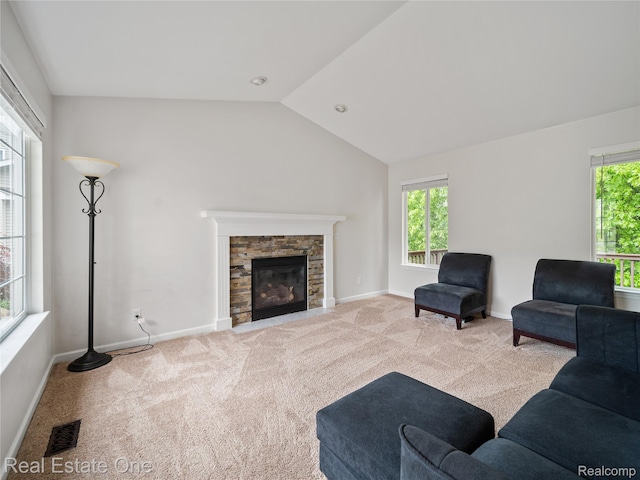 8859 Redstone Dr, Pinckney, MI 48169 - living room with carpet flooring, vaulted ceiling, a fireplace, and baseboards
