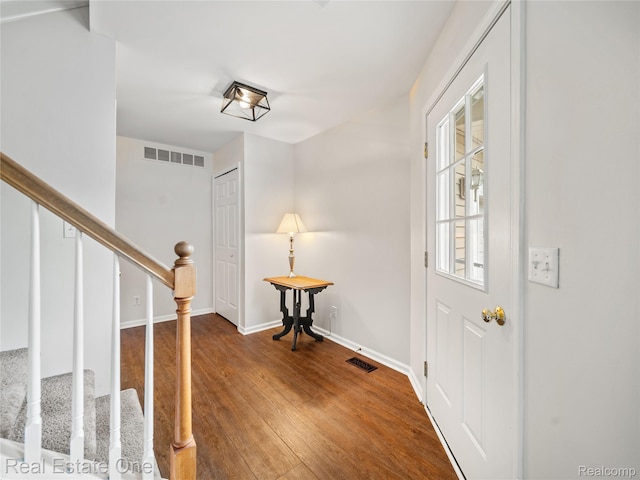 8859 Redstone Dr, Pinckney, MI 48169 - entrance foyer featuring wood finished floors, stairs, and baseboards