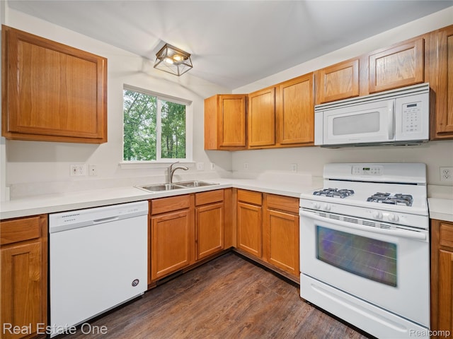 8859 Redstone Dr, Pinckney, MI 48169 - kitchen with white appliances, a sink, dark wood-style flooring, light countertops, and brown cabinets