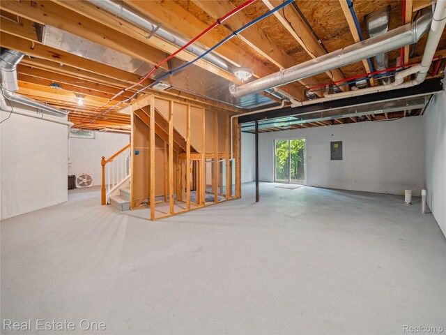 8859 Redstone Dr, Pinckney, MI 48169 - below grade area featuring stairway and electric panel