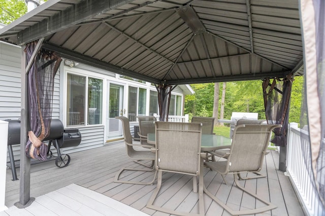 66 Meridian Ct, Mount Pleasant, MI 48858 - deck featuring a gazebo, outdoor dining space, and a grill