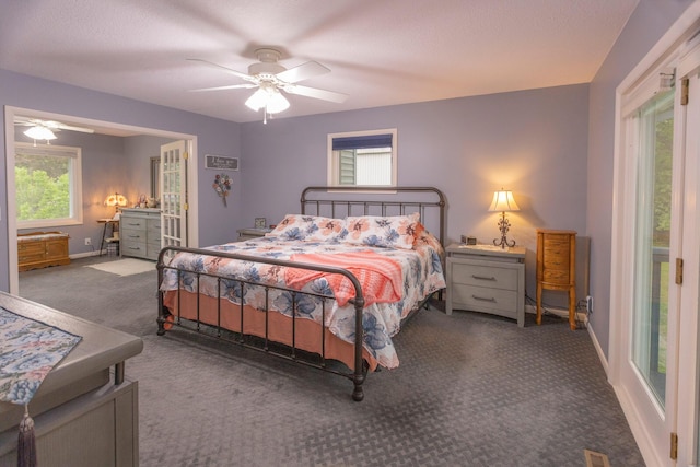 66 Meridian Ct, Mount Pleasant, MI 48858 - carpeted bedroom with baseboards and a ceiling fan
