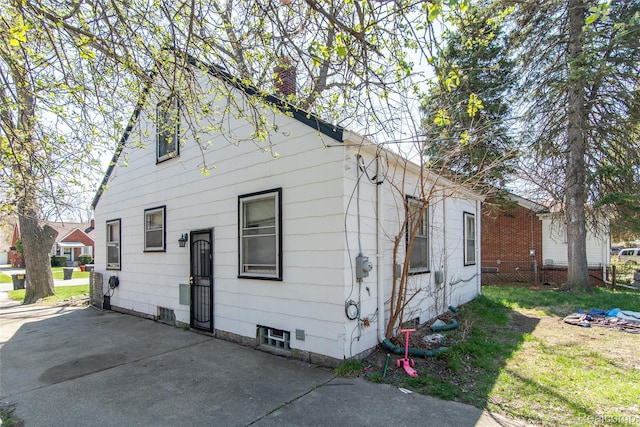 19683 Sunset St, Detroit, MI 48234 - view of home's exterior featuring a chimney