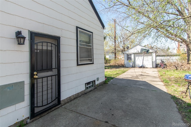 19683 Sunset St, Detroit, MI 48234 - doorway to property featuring driveway and a garage