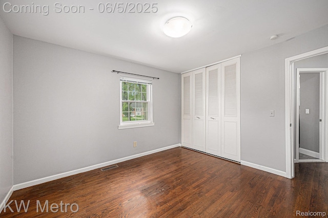 1360 Trailwood Path, Bloomfield Hills, MI 48301 - unfurnished bedroom featuring a closet, wood finished floors, and baseboards