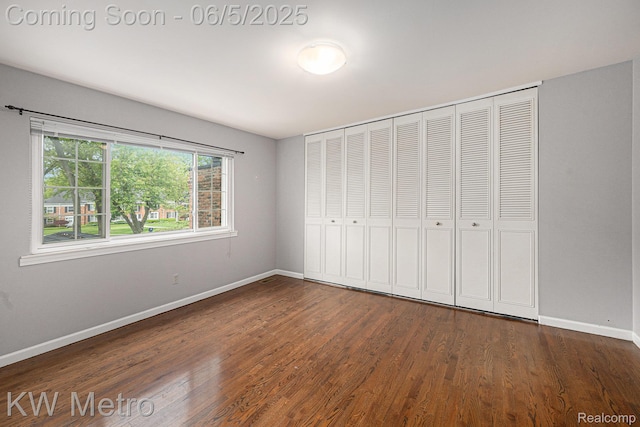 1360 Trailwood Path, Bloomfield Hills, MI 48301 - unfurnished bedroom featuring baseboards, wood finished floors, and a closet