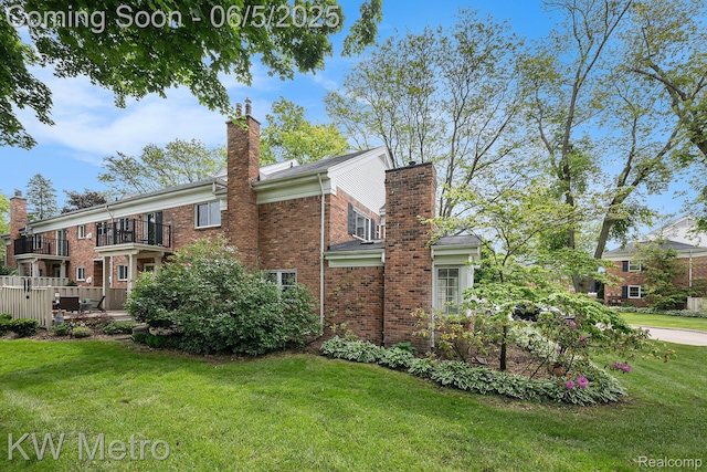 1360 Trailwood Path, Bloomfield Hills, MI 48301 - view of side of home with a chimney, a balcony, brick siding, and a yard