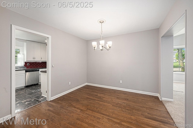 1360 Trailwood Path, Bloomfield Hills, MI 48301 - unfurnished room featuring a chandelier, baseboards, and dark wood finished floors
