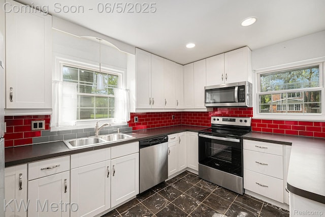 1360 Trailwood Path, Bloomfield Hills, MI 48301 - kitchen featuring stainless steel appliances, a sink, white cabinets, dark countertops, and recessed lighting