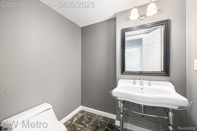 1360 Trailwood Path, Bloomfield Hills, MI 48301 - half bathroom featuring baseboards, marble look tile flooring, and toilet