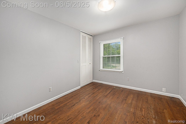 1360 Trailwood Path, Bloomfield Hills, MI 48301 - empty room featuring baseboards and dark wood-type flooring