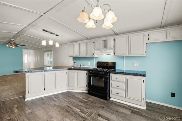 49831 Leicester Ct, Shelby Twp, MI 48315 - kitchen with black gas range, under cabinet range hood, a peninsula, a chandelier, and dark wood-type flooring