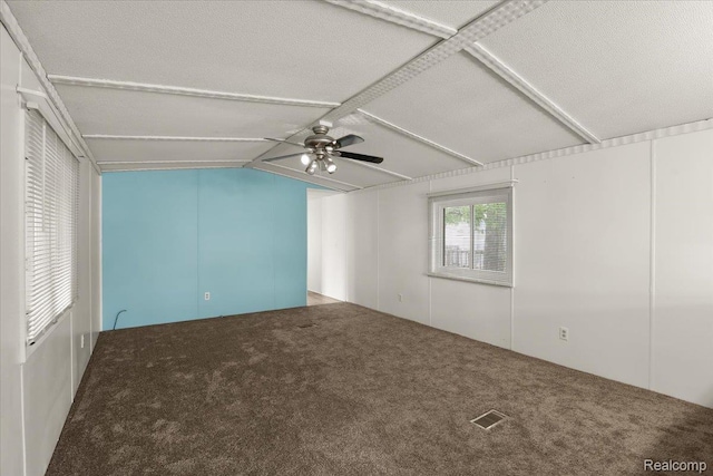 49831 Leicester Ct, Shelby Twp, MI 48315 - carpeted empty room featuring vaulted ceiling, attic access, and ceiling fan