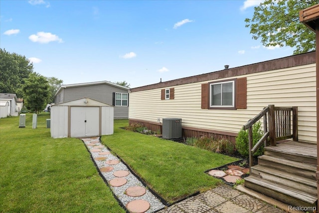 49831 Leicester Ct, Shelby Twp, MI 48315 - back of house with central AC unit and a yard