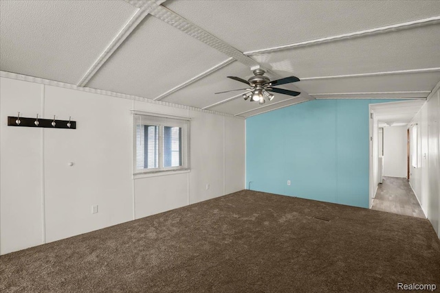 49831 Leicester Ct, Shelby Twp, MI 48315 - empty room with a ceiling fan, carpet floors, vaulted ceiling, and a textured ceiling