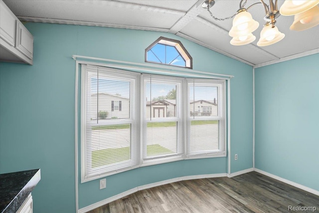 49831 Leicester Ct, Shelby Twp, MI 48315 - unfurnished dining area featuring a chandelier, dark wood-type flooring, vaulted ceiling, and baseboards
