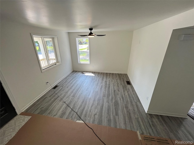 1015 9th St, Port Huron, MI 48060 - unfurnished living room with wood finished floors and ceiling fan