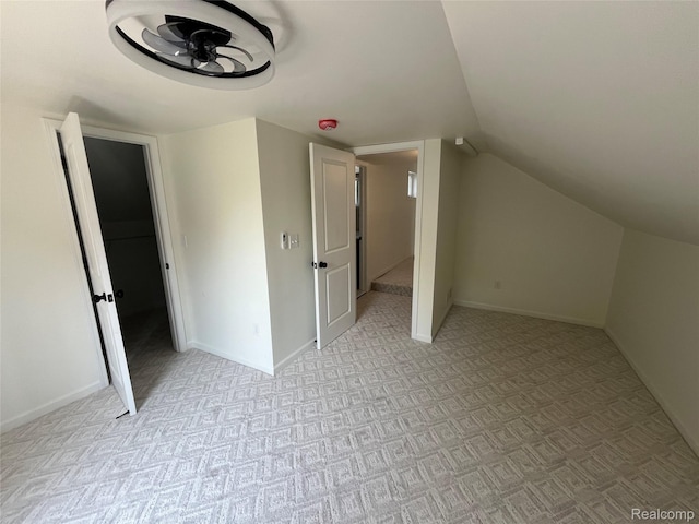 1015 9th St, Port Huron, MI 48060 - additional living space featuring light colored carpet, vaulted ceiling, and a ceiling fan