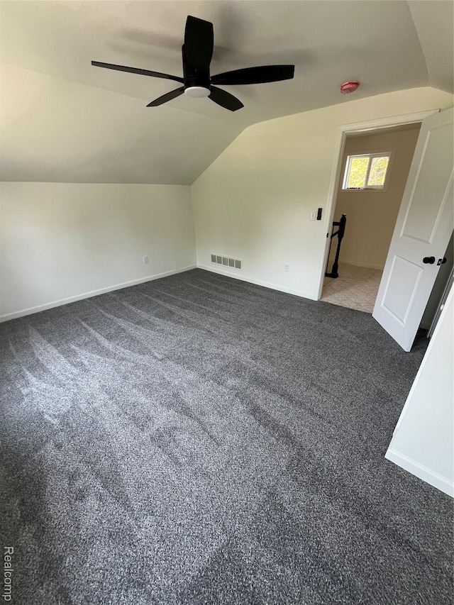 1015 9th St, Port Huron, MI 48060 - additional living space with vaulted ceiling, a ceiling fan, and carpet flooring