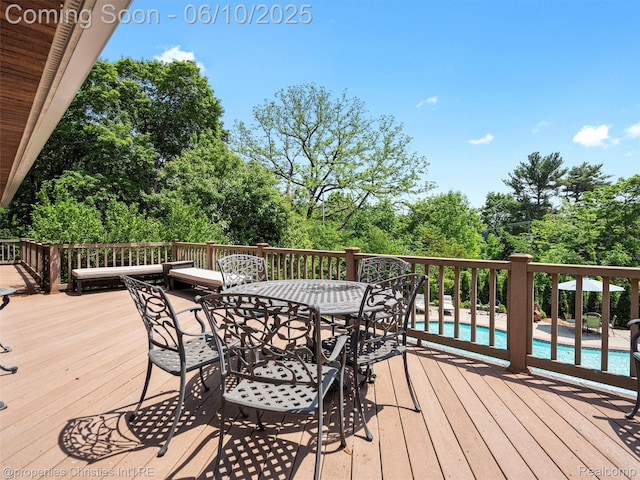 4383 Pine Tree Trl, Bloomfield Hills, MI 48302 - deck featuring view of scattered trees and outdoor dining area