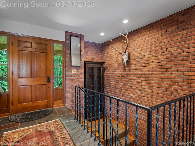 4383 Pine Tree Trl, Bloomfield Hills, MI 48302 - entryway featuring brick wall and recessed lighting